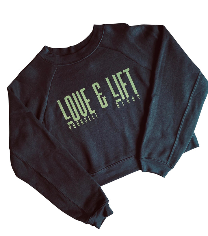 JSD Apparel black cropped fleece pullover with raglan sleeves and Love Yourself & Lift Heavy green graphic print