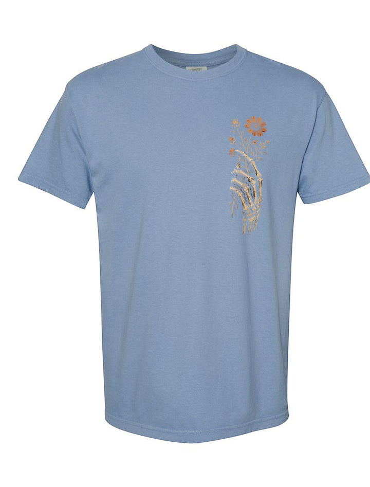 JSD Apparel blue Comfort Colors unisex tee with a vintage skeletal hand and floral graphic on the left chest