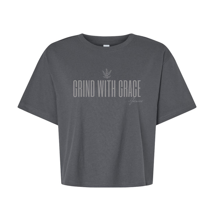 JSD Apparel charcoal cropped tee with Grind With Grace graphic and sage sprig icon in a relaxed boxy fit.