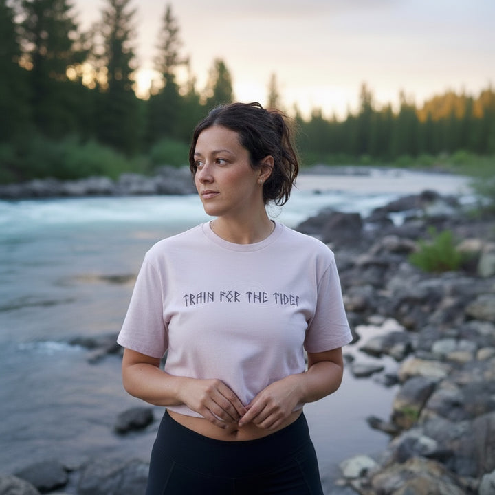 JSD Apparel light pink cropped t-shirt with "Train for the Tides" graphic, crew neck, and relaxed fit.