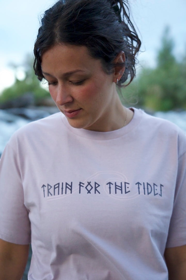 JSD Apparel light purple cropped t-shirt with "Train for the Tides" graphic and wave design.