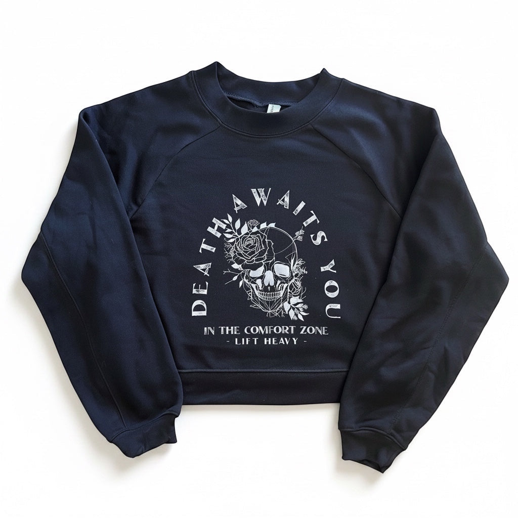 JSD Apparel black cropped fleece pullover with white skull and floral graphic print and raglan sleeves.