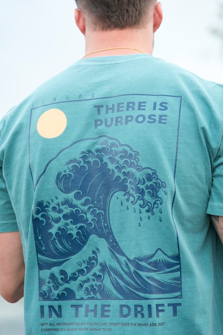 JSD Apparel seafoam heavyweight cotton t-shirt with back wave graphic and There Is Purpose in the Drift text.