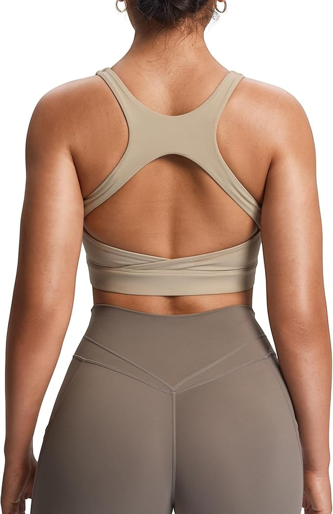 JSD Apparel driftwood beige sports bra with crossback straps and open back cutout on a model