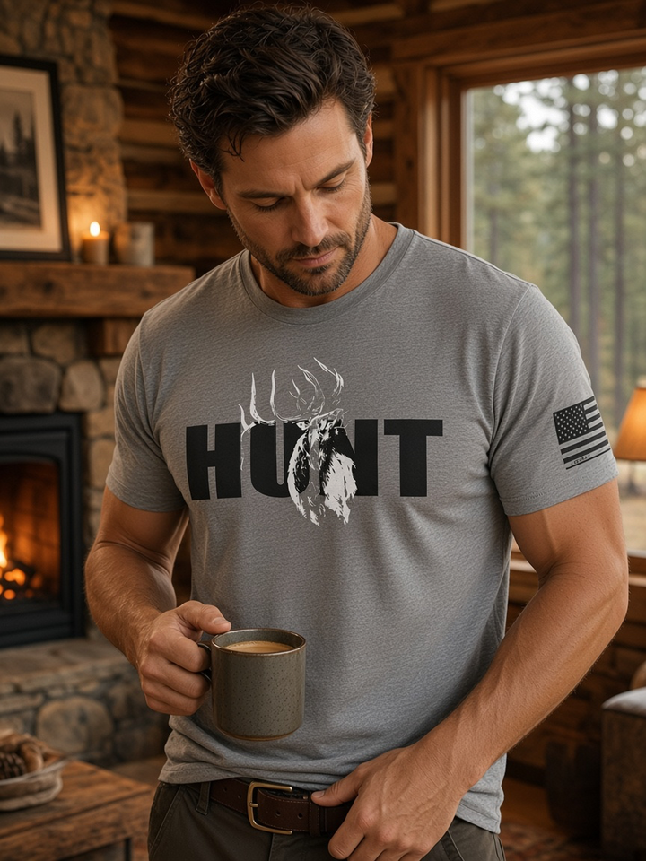JSD Apparel grey triblend t-shirt featuring a HUNT graphic with a bugling elk and American flag sleeve detail