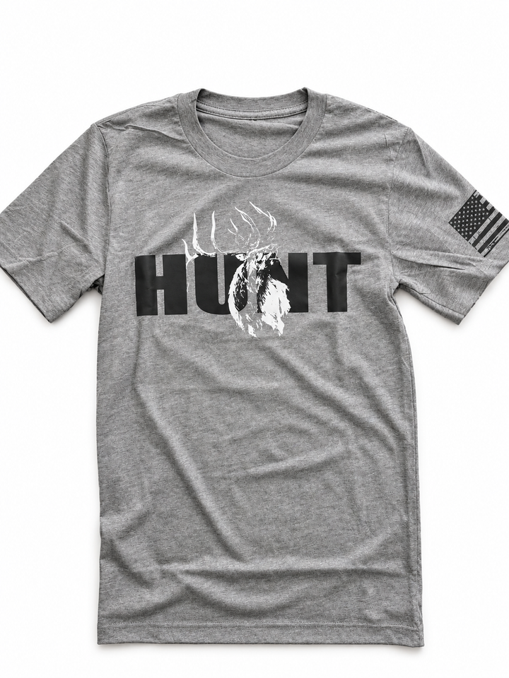 JSD Apparel grey triblend t-shirt featuring a black HUNT graphic with a bugling elk and American flag sleeve detail.