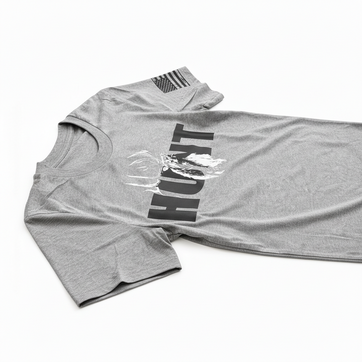 JSD Apparel grey triblend t-shirt with HUNT graphic and bugling elk design, featuring an American flag sleeve detail.