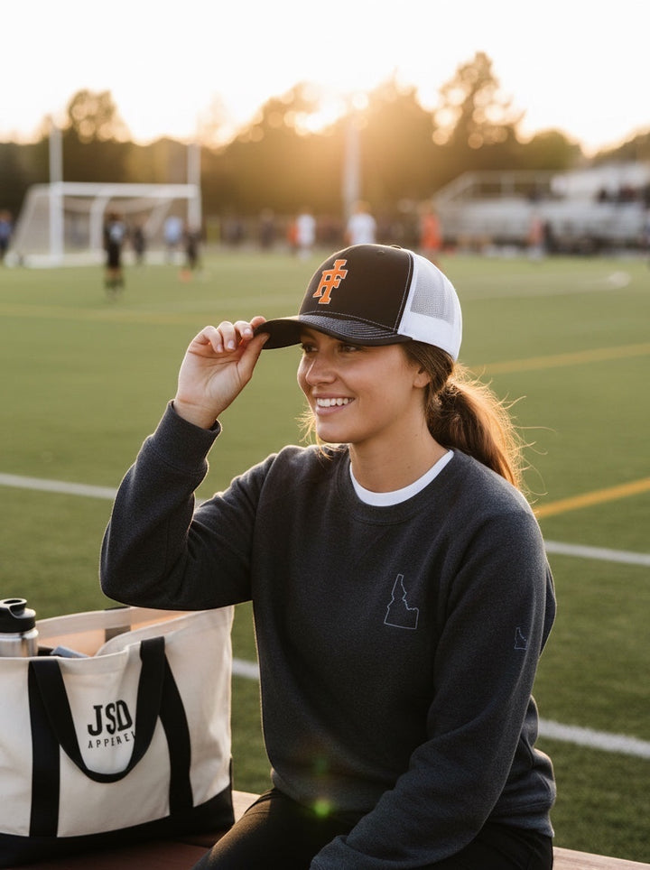JSD Apparel Idaho Falls Tigers Richardson 112 snapback hat with black front, white mesh back, and orange IF logo.