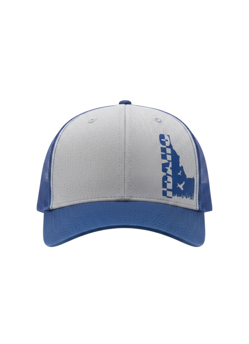 JSD Apparel Idaho Flyway trucker hat in royal blue and heather gray with a duck silhouette and Idaho state graphic.