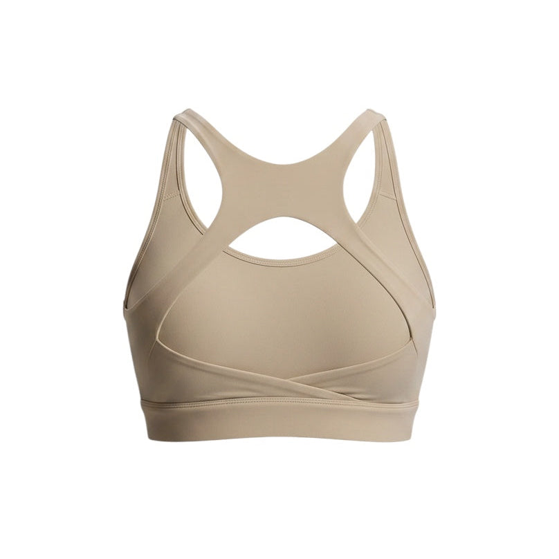 JSD Apparel Jenvae beige sports bra with a longline band, crossback straps, and open cutout design.