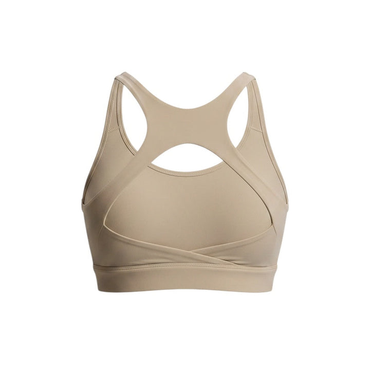 JSD Apparel Jenvae beige sports bra with a longline band, crossback straps, and open cutout design.