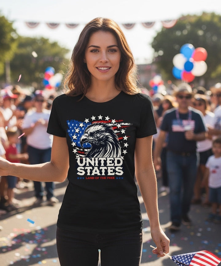 Woman wearing a black JSD Apparel Land of The Free Eagle tee with a patriotic American flag and eagle graphic.