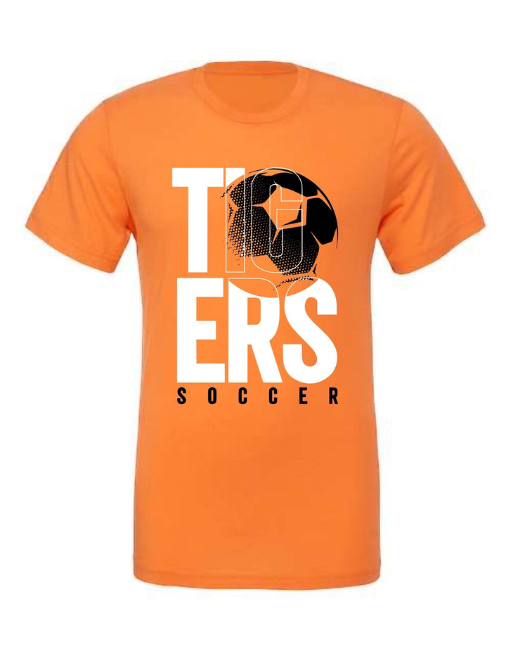 JSD Apparel orange unisex jersey tee featuring a white and black stacked TIGERS soccer graphic with a ball design.