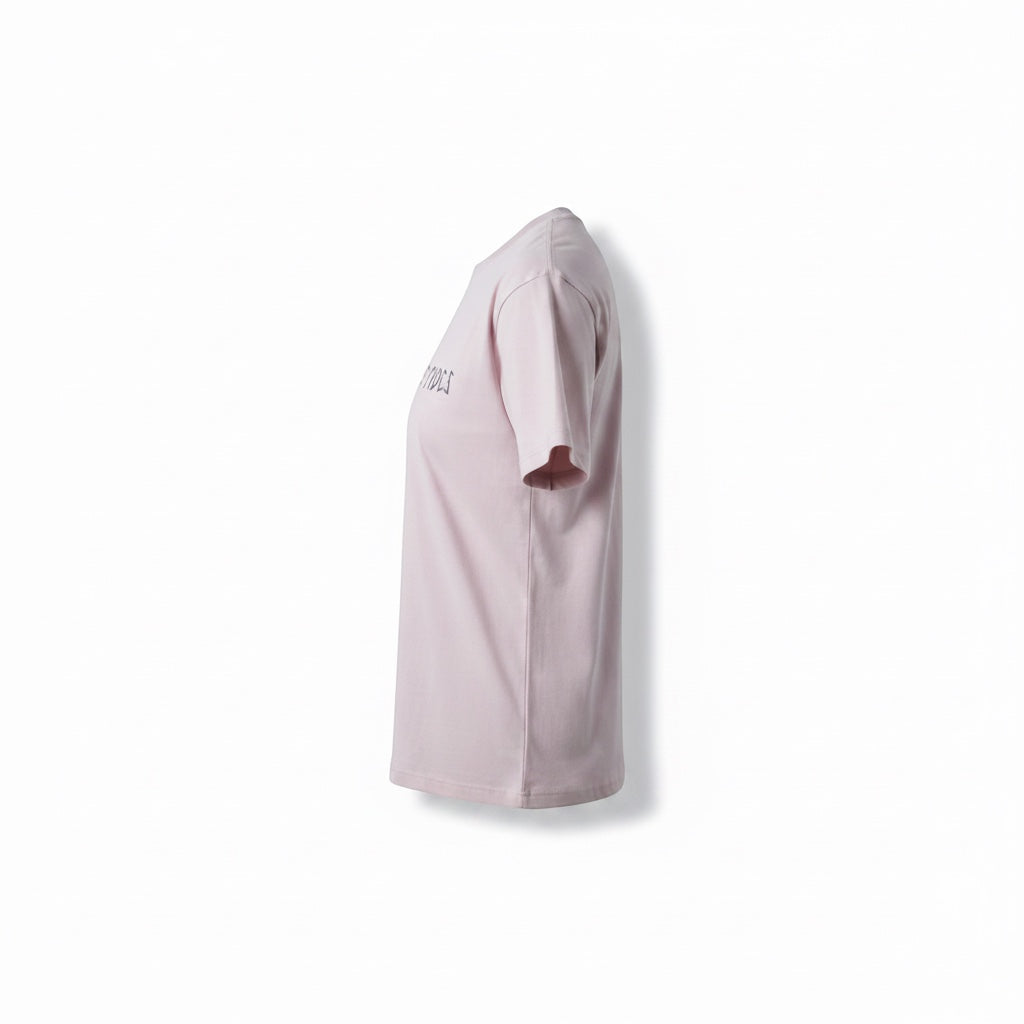 JSD Apparel light pink cotton blend cropped t-shirt with crew neckline and graphic text on front.