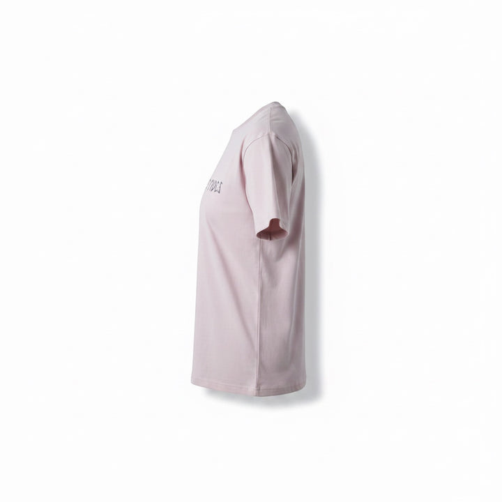 JSD Apparel light pink cotton blend cropped t-shirt with crew neckline and graphic text on front.