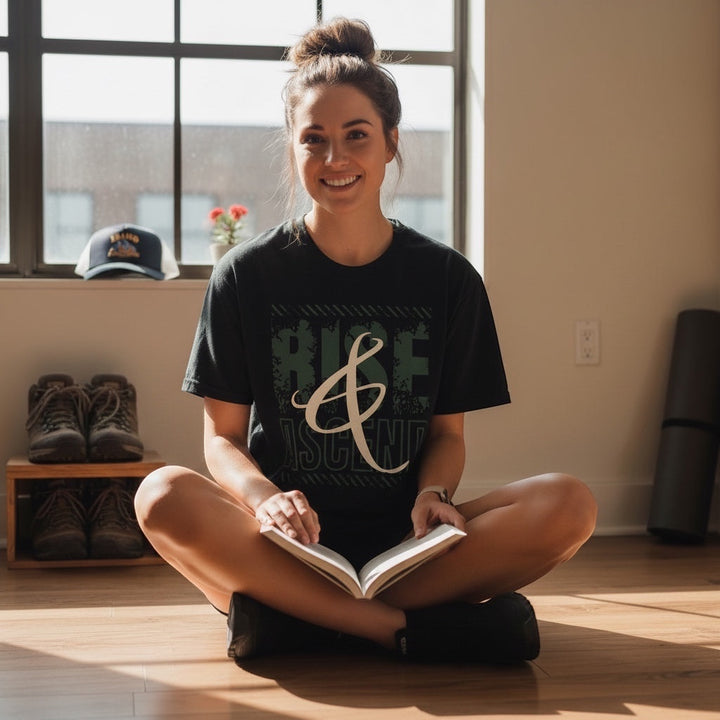 JSD Apparel Rise & Ascend unisex cotton t-shirt in jet black with sage and bone-toned distressed graphic print.