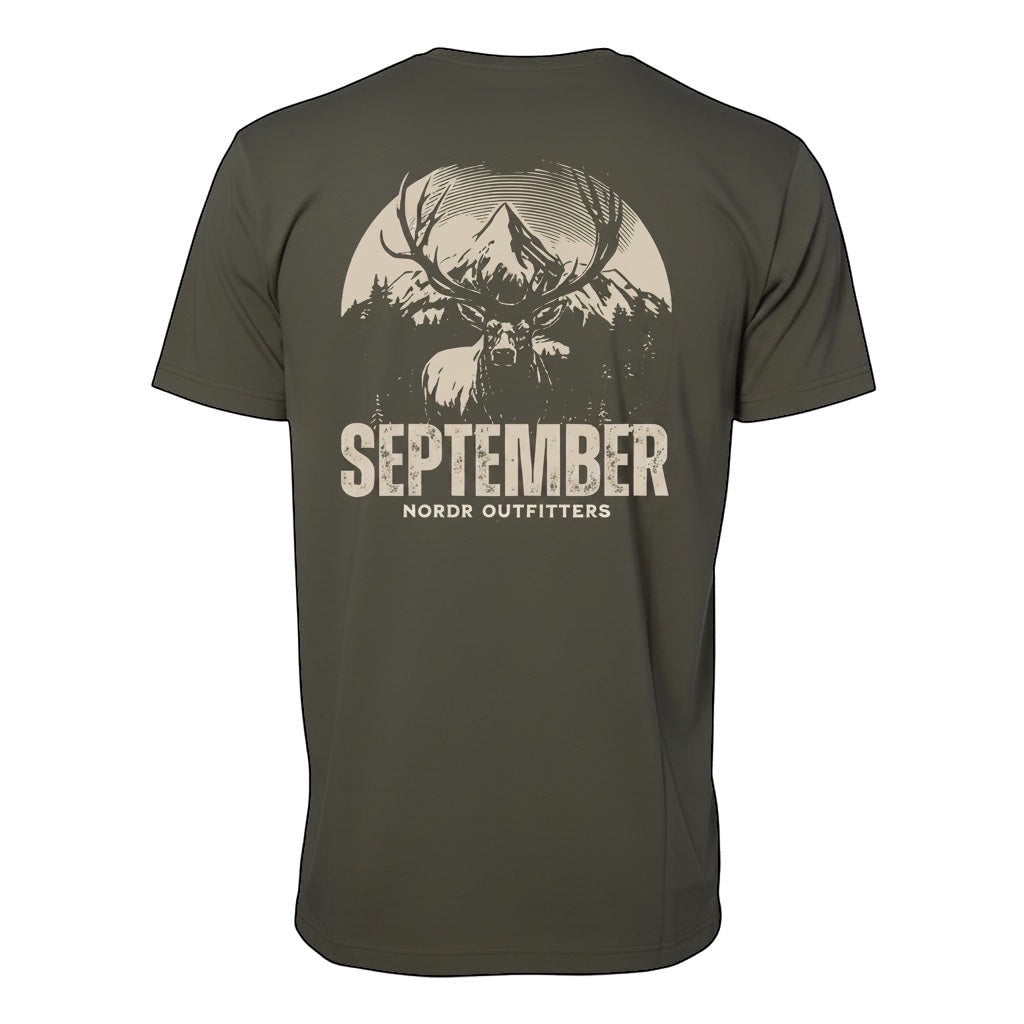 JSD Apparel olive green cotton t-shirt with a vintage elk and mountain graphic on the back and "SEPTEMBER NORDR OUTFITTERS" text.