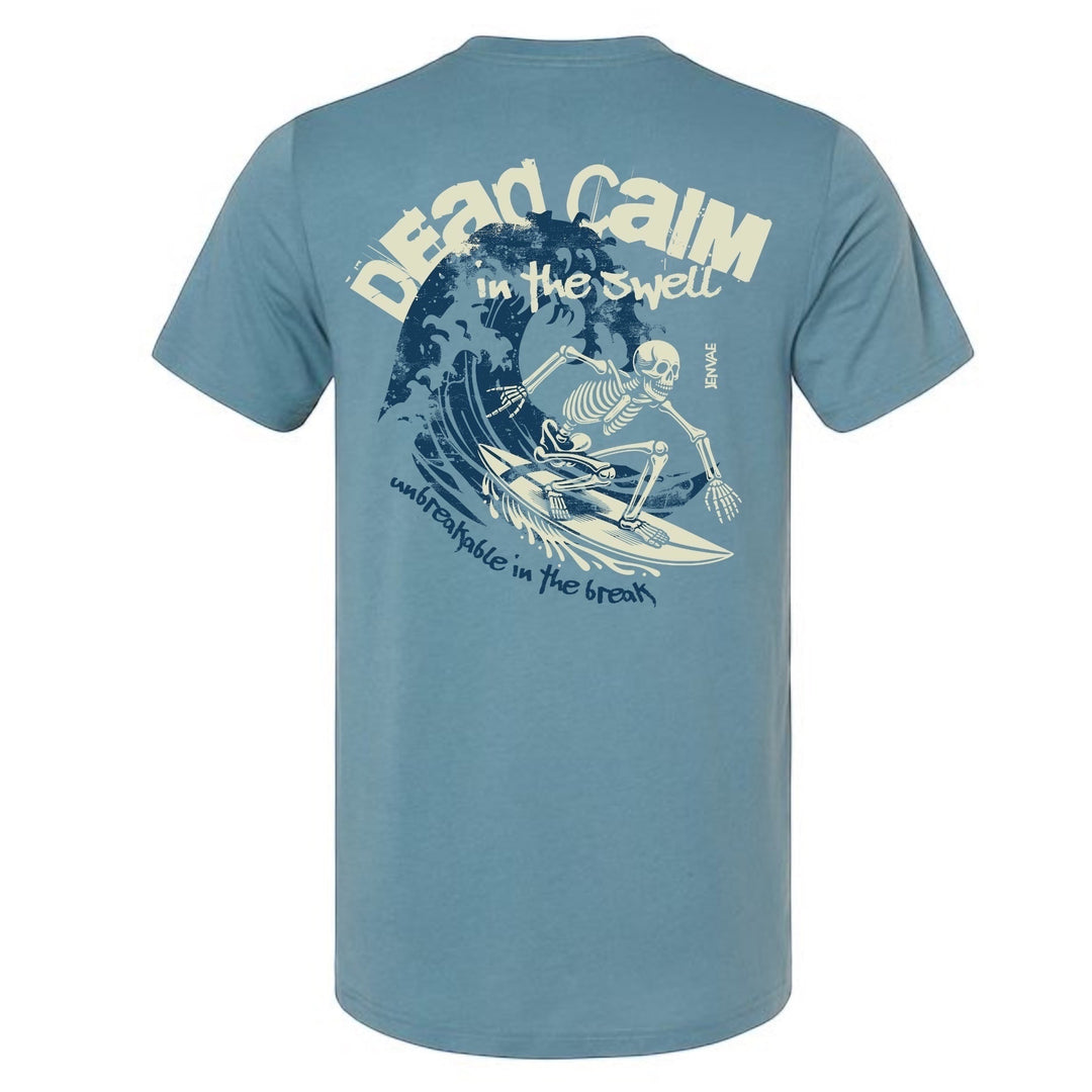 JSD Apparel blue cotton blend t-shirt featuring a back graphic of a skeleton surfing a wave with bold text.