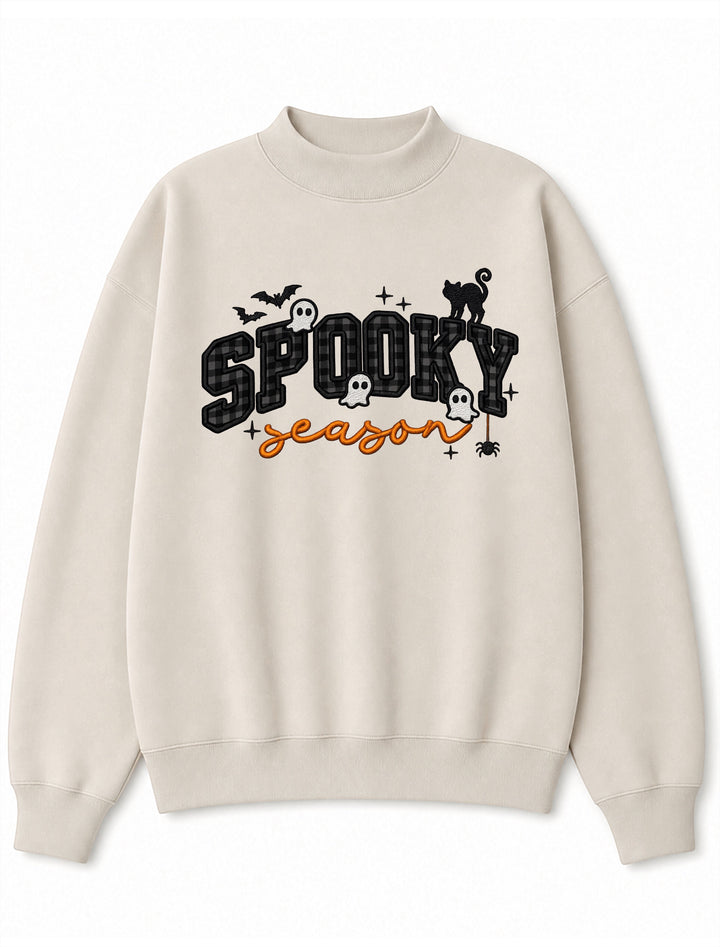 JSD Apparel beige mock neck sweatshirt with Spooky Season varsity plaid lettering, ghosts, bats, and a black cat.