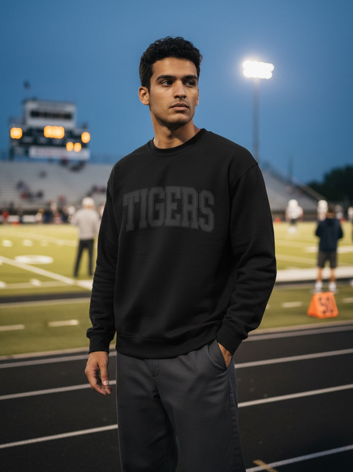 JSD Apparel black cotton blend crewneck sweatshirt with grey collegiate "TIGERS" arch text, relaxed fit.