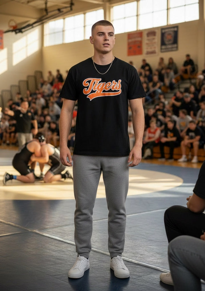 JSD Apparel black 100% cotton t-shirt with orange and white Idaho Falls Tigers script logo, unisex fit.