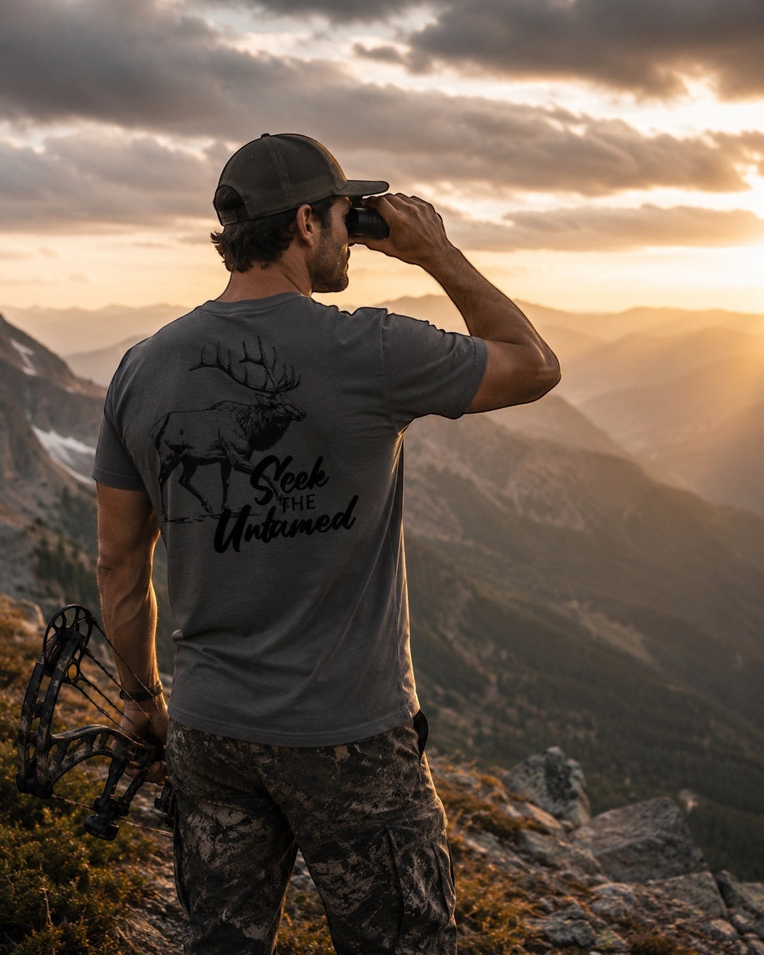 JSD Apparel men's charcoal grey short-sleeve tee with elk graphic and "Seek the Untamed" text on back.