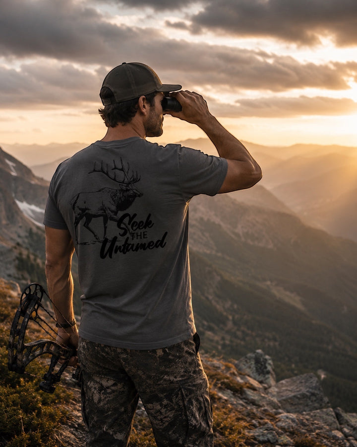 JSD Apparel men's charcoal grey short-sleeve tee with elk graphic and "Seek the Untamed" text on back.