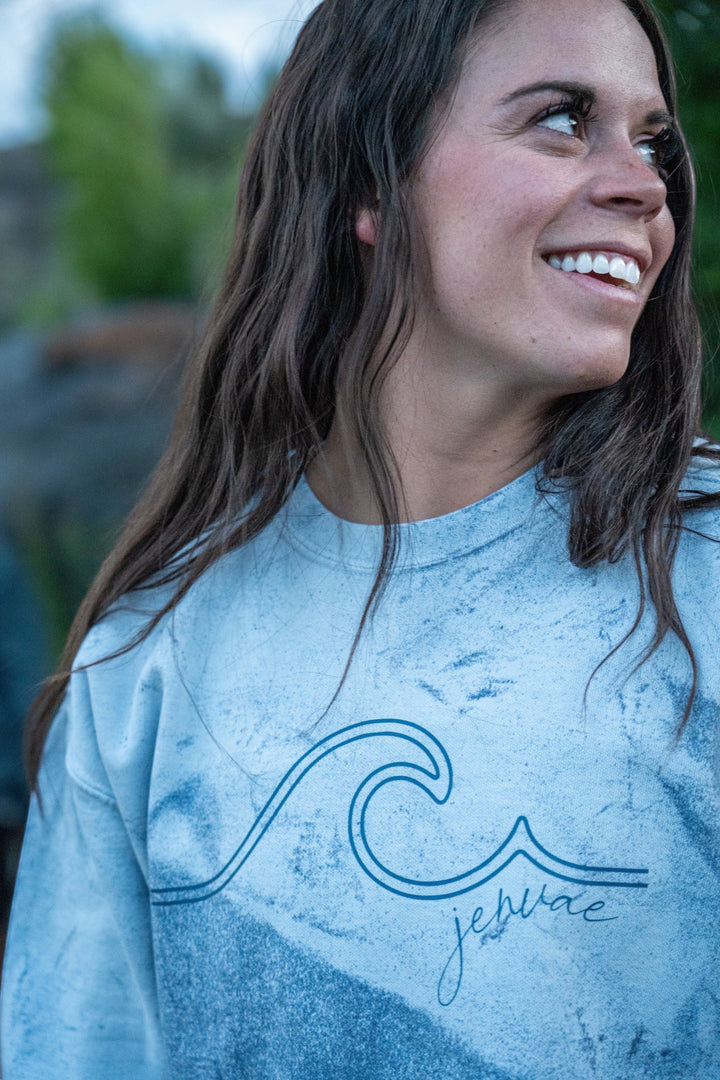 JSD Apparel ocean wash blue crewneck sweatshirt with wave graphic and Jenvae script logo, cotton/poly blend